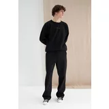 Trendyol Black Men's More Sustainable Oversize Sweatpants with Pocket, Textured Fabric Detail.