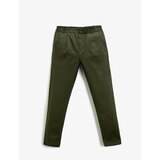 Koton Fabric Carrot Trousers with Button Detail Pocket. cene