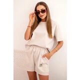 Kesi Włoski Women's punto set with short sleeves and loose shorts beige Cijene