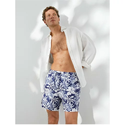 Koton Marine Shorts with a floral print, a drawstring waist with pockets.