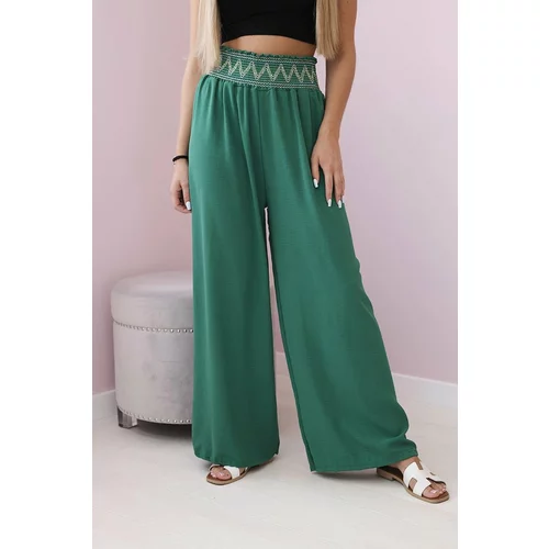 Kesi Trousers with a wide elastic waistband in green colour