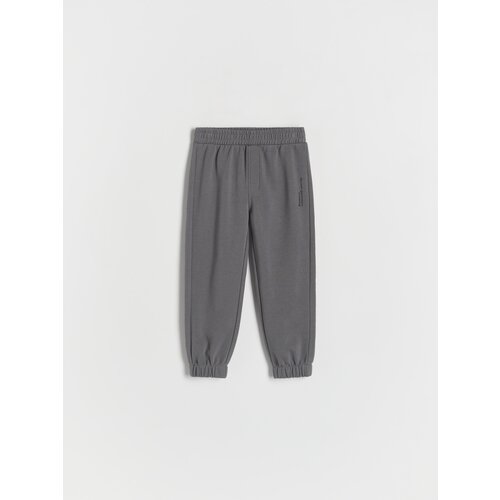 Reserved bombažne hlače jogger - siva Cene