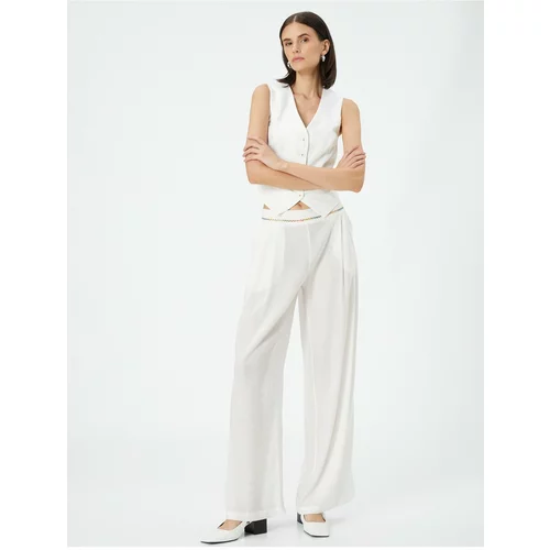 Koton Palazzo Trousers Loose Fit, Normal Waist, Pockets with Embroidery Detail.