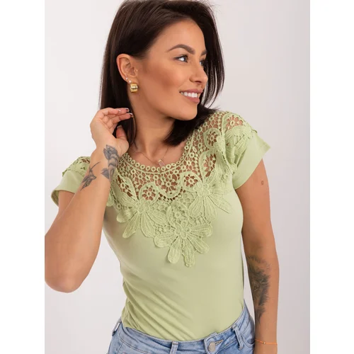 Fashion Hunters Pistachio women's blouse with lace on the back