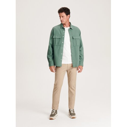 Reserved - Bombažne hlače slim fit - Bež Cene