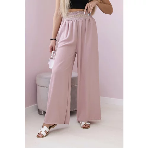 Kesi Trousers with a wide elastic waistband in dark pink colour