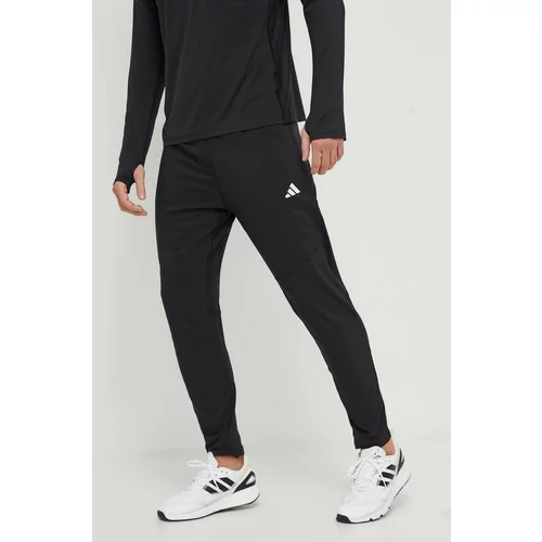 Adidas Hlače za trčanje Own the Run boja: crna, s tiskom