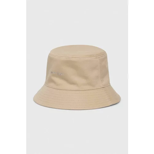 Calvin Klein Dvostranski bombažen klobuk bež barva
