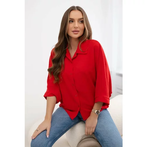 Kesi Oversized blouse with red button fastening