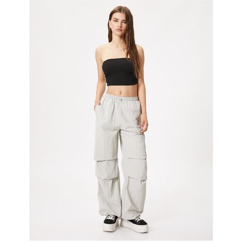 Koton Loose Parachute Trousers with Fold Detail. Slike
