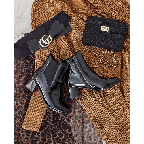 Resti Black women's boots on a low post Nekery Cene