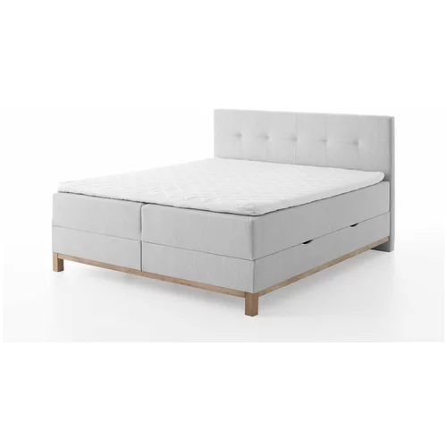 Meise Möbel Svijetlo sivi boxspring krevet s prostorom za odlaganje 180x200 cm Catania -