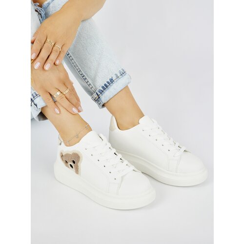 Shelvt White women's sports shoes with a teddy bear Cijene