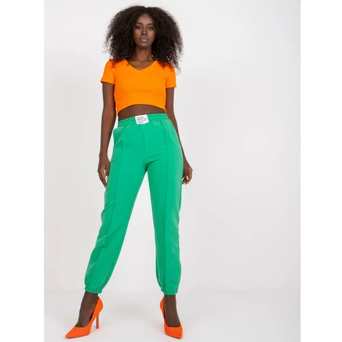 Fashion Hunters Dark green women's trousers in a fabric with a crease