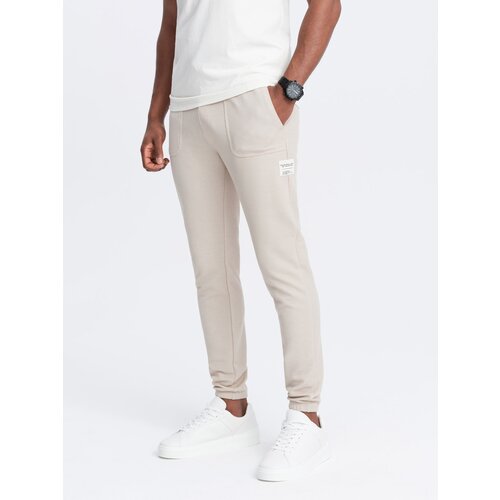 Ombre Men's structured knit sweatpants - light beige Cene