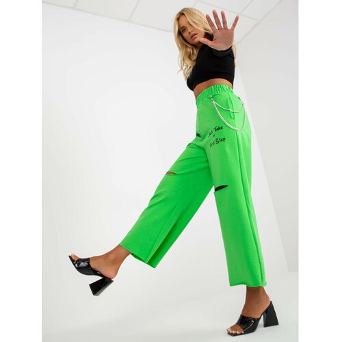 Fashion Hunters Light green wide sweatpants with holes Slike