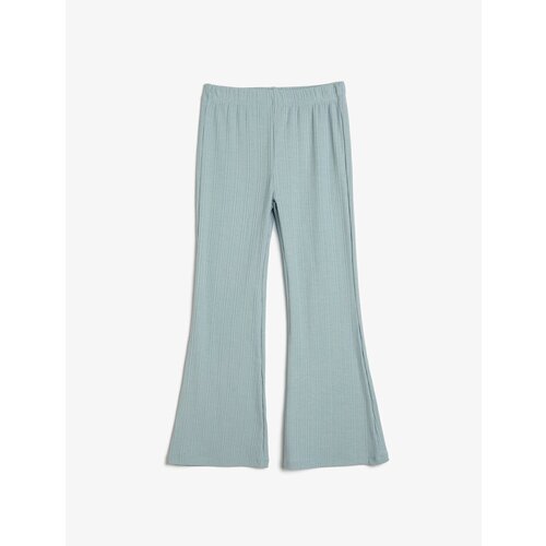 Koton Spanish Leg Leggings Trousers have a relaxed fit, elasticated, textured waist. Cene