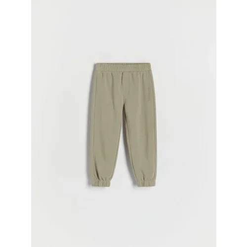 Reserved bombažne hlače jogger - zelena