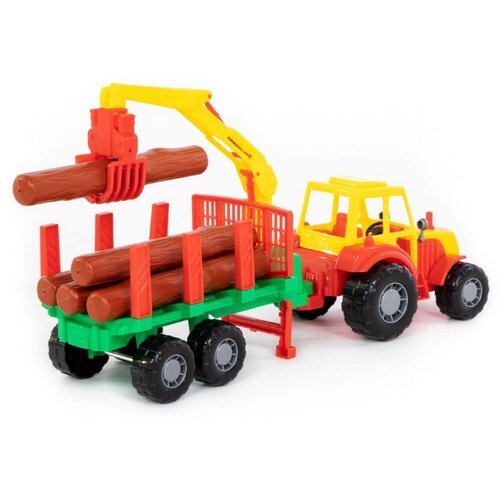 Polesie traktor s balvanima u prikolici Slike