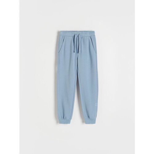 Reserved bombažne hlače jogger - modra Cene