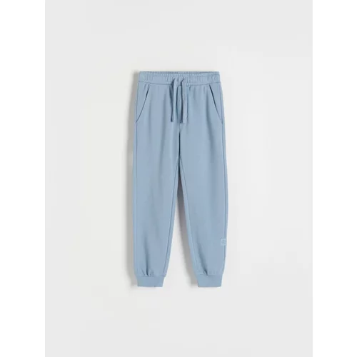 Reserved bombažne hlače jogger - modra