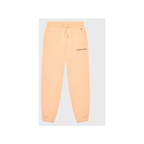 Calvin Klein Jeans Spodnji del trenirke Logo IG0IG01509 Oranžna Relaxed Fit
