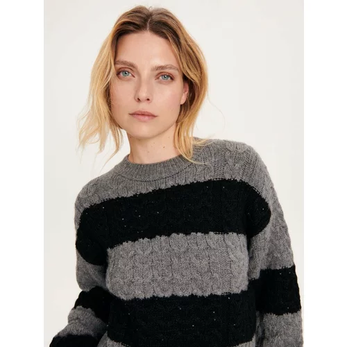 Reserved pulover s pletenim vzorcem - večbarvno