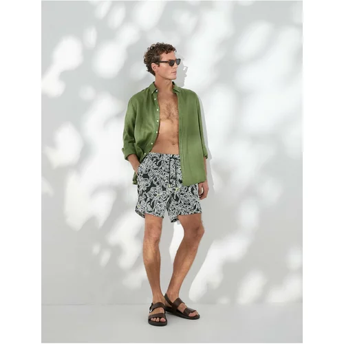 Koton Swimwear Marine Shorts with a lace-up waist with pockets.