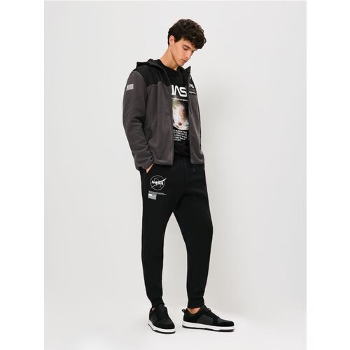 Sinsay Tapered fit hlače NASA Cijene