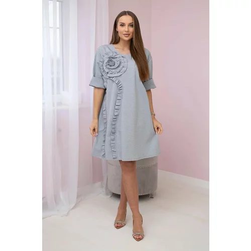 Kesi Dress with a decorative flower of gray color