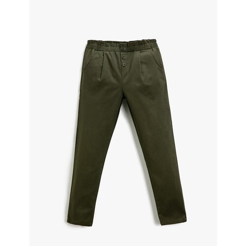 Koton Fabric Carrot Trousers with Button Detail Pocket. Slike