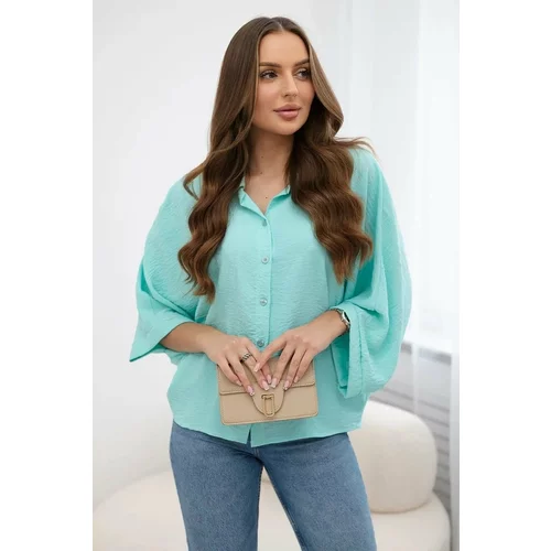 Kesi Mint-colored oversized blouse with button closure