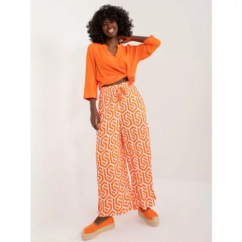 Fashion Hunters Orange wide trousers with SUBLEVEL print