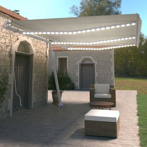 Tenda na ručno uvlačenje s LED svjetlima 600x350 cm krem Slike