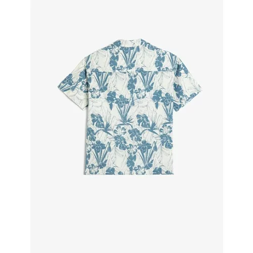 Koton Boy's linen shirt with a floral print, short sleeves and pockets.