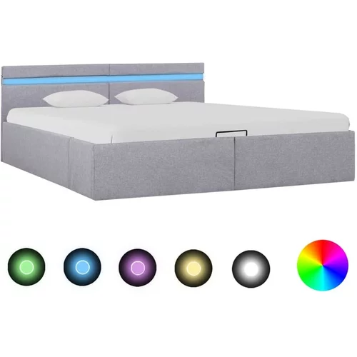  Dvižni posteljni okvir LED svetlo sivo blago 180x200 cm