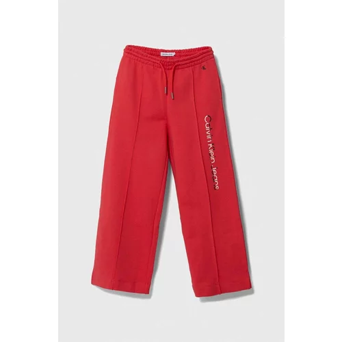 Calvin Klein Jeans Otroška bombažna trenirka rdeča barva
