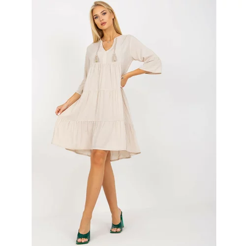 Fashion Hunters Light beige oversize dress with a frill and 3/4 sleeves