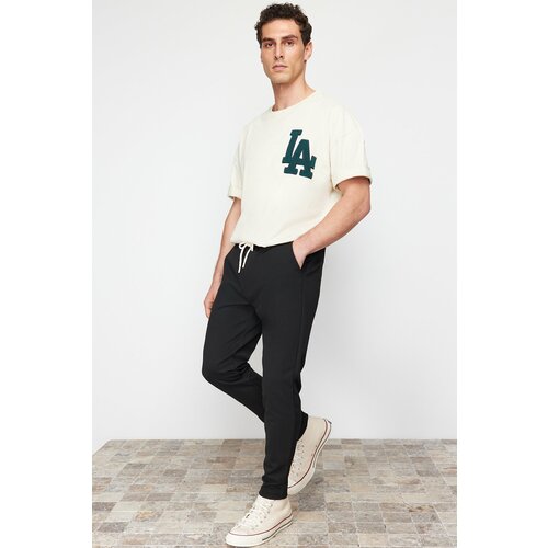 Trendyol Black Jogger Fit Laced Waist Textured Fabric Pants Cene