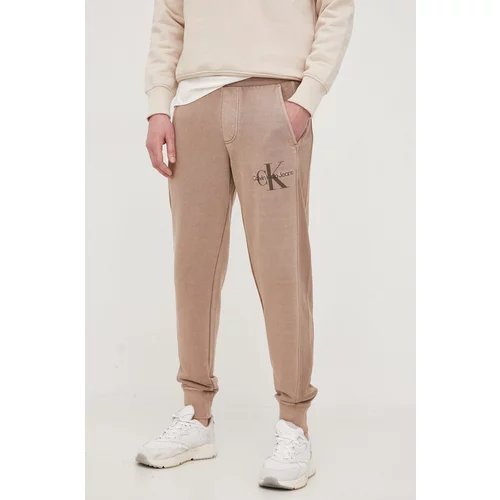 Calvin Klein Jeans Pamučni donji dio trenirke boja: smeđa, glatki materijal