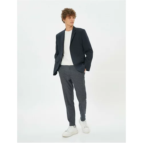 Koton Patterned Woven Trousers with Pockets and Buttons.