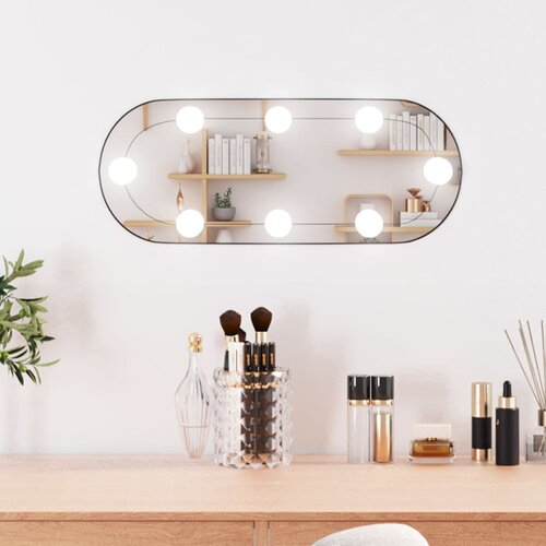 vidaXL Stensko ogledalo z LED lučkami 25x60 cm stekleno ovalno Cene