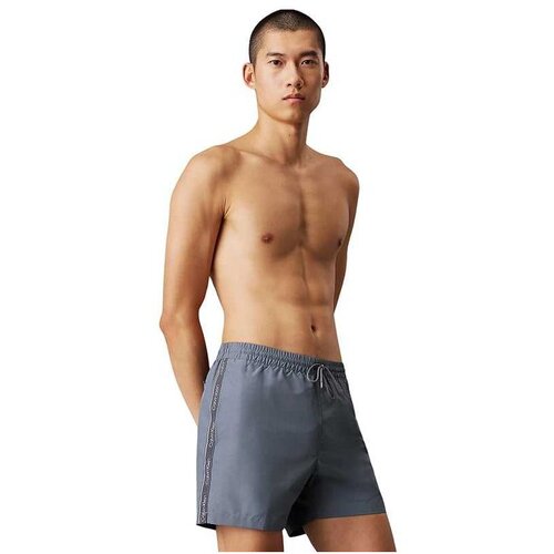 Calvin Klein sivi muški kupaći CKKM0KM01109-PCP Slike