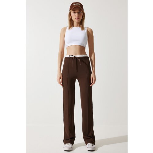 woman's brown detailed knitted trousers Slike