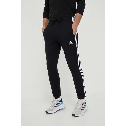 Adidas Pamučni donji dio trenirke boja: crna, s aplikacijom Slike
