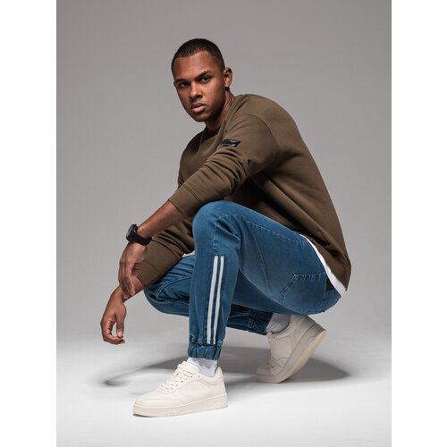 Ombre Men&amp;#039;s denim joggers with asymmetrical stitching - blue Slike