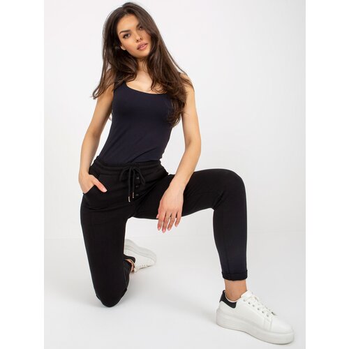 Fashion Hunters Black women's sweatpants with buttons Cene