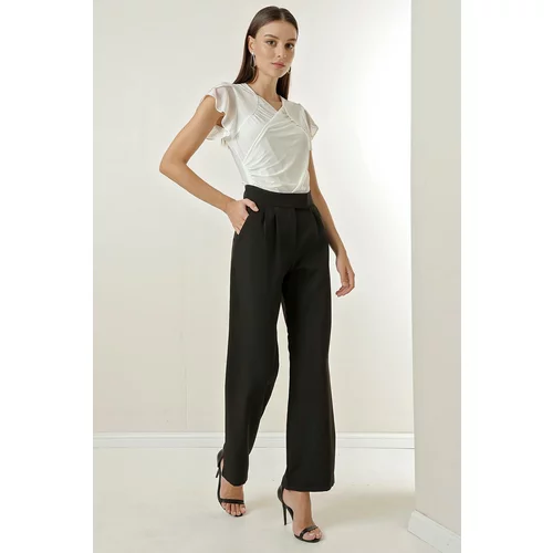 By Saygı A snap fastener at the waist, Pockets and Wide Leg Trousers.