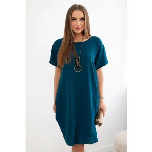 Kesi Dress with pockets and a navy pendant