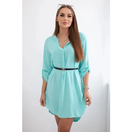 Kesi Dress with a longer back and a mint belt